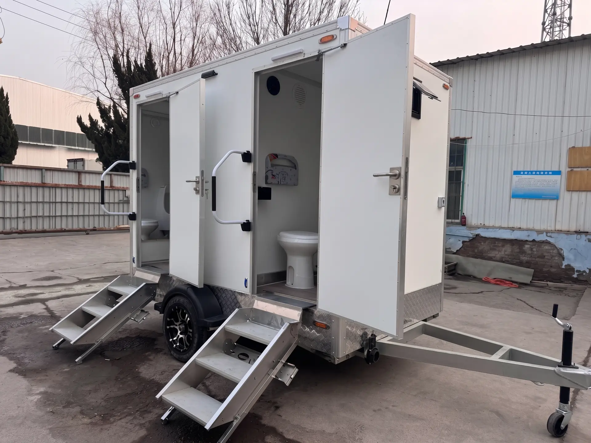 Luxury Loos two-stall restroom trailer set up at an outdoor event
